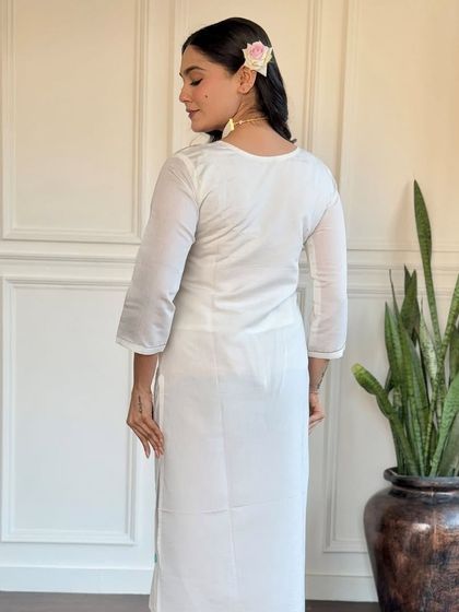 This off-white viscose chanderi kurta is a classic. The delicate embroidery and printed floral dupatta in shades of blue add a touch of color and grace.