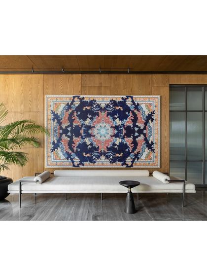 Opposite the console in the K Residence lobby is a long, minimalist bench from my Koko collection, placed beneath a Jason Seife artwork. This area serves as an extension for large gatherings, allowing guests to flow from the living room.