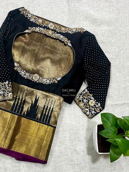 A timeless combination of gold, silver, and black. This blouse, designed for a Kanjeevaram saree, features a dramatic keyhole back framed with floral embroidery.
