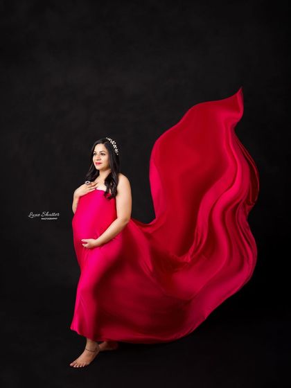 A barefoot, powerful stance with the red fabric creating a beautiful wing-like shape. This portrait is all about strength and beauty.