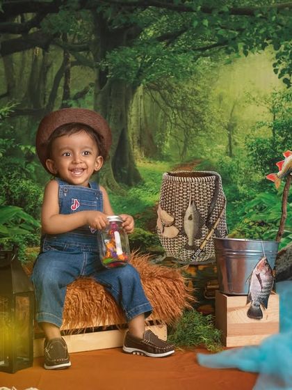 Done for the day! A happy little fisherman shows off his jar of treats after a successful day of fishing in our forest stream setup.