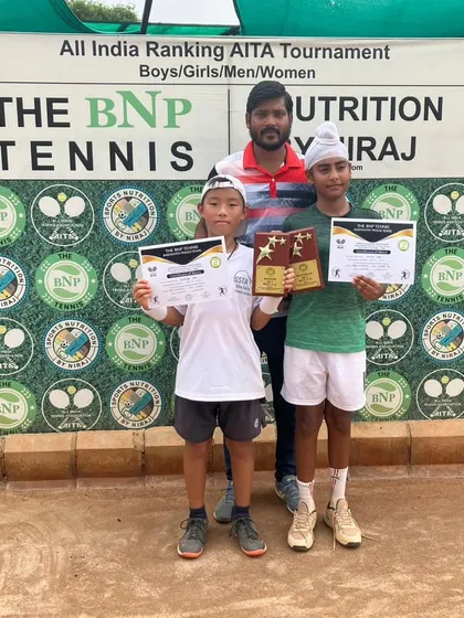 Toshi celebrating a double crown, winning both the Singles and Doubles titles at the AITA U12 Championship Series in Delhi.
