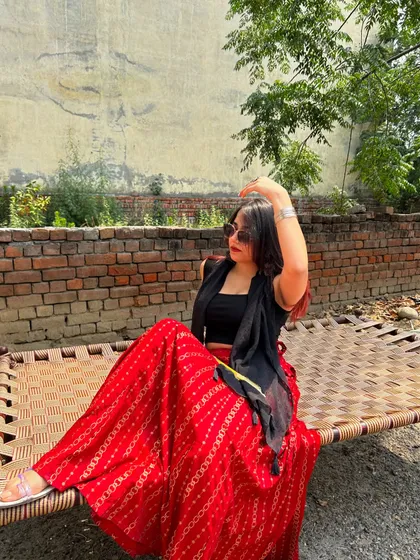 Relaxing on a charpai in a traditional Indian village. This shows a different kind of travel experience, away from the usual tourist spots.