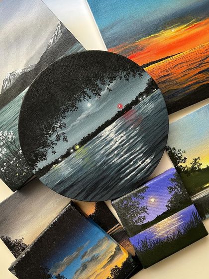 The round nightscape painting surrounded by other mini paintings.
