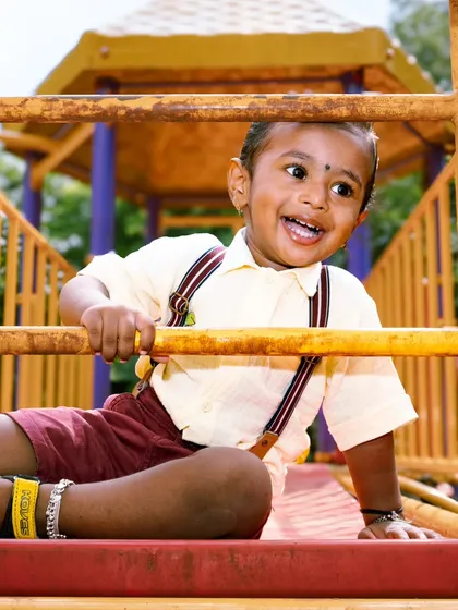 The pure, unfiltered joy of childhood is what I aim for in my kids' photography sessions. This little guy's laughter at the park made for a perfect, energetic shot that the family will cherish forever.