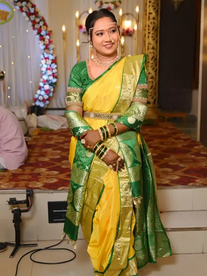 The bride poses gracefully, showing off her complete look. My service includes draping the Nauvari saree in a way that is both traditional and easy to manage.
