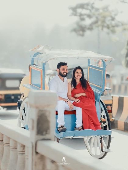 A unique and fun shot of the couple riding in a hand-pulled rickshaw, a classic element of old city charm.