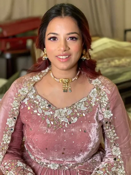 Another shot of this stunning look. The makeup enhances her features and complements her unique style.