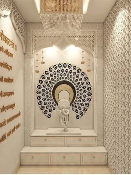 This grand pooja room showcases exceptional craftsmanship with floor-to-ceiling intricate jali work and marble carvings. A stunning peacock feather mandala creates a divine backdrop for the Krishna idol, while a crystal chandelier adds a layer of opulence.