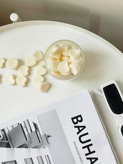 Unwind and indulge with our heart-shaped wax melts. This minimalist shot captures their simple charm.