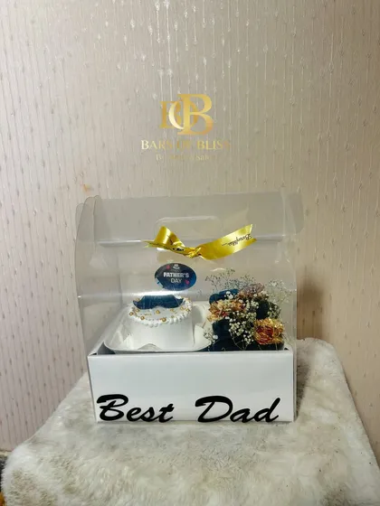 This "Best Dad" hamper includes a small cake and a beautiful floral arrangement in a clear, portable gift box.