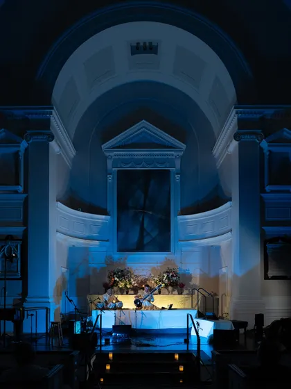 The beautiful architecture of All Souls NYC, bathed in blue light for our 'Sitar for Mental Health' gathering. The venue is a crucial part of the experience, and this historic church provided a serene and sacred-feeling space for our musical meditation.