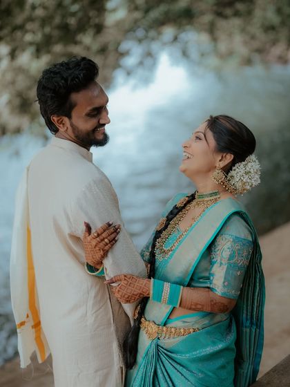 A joyful, laughing moment between the couple. This candid shot perfectly captures their happiness.