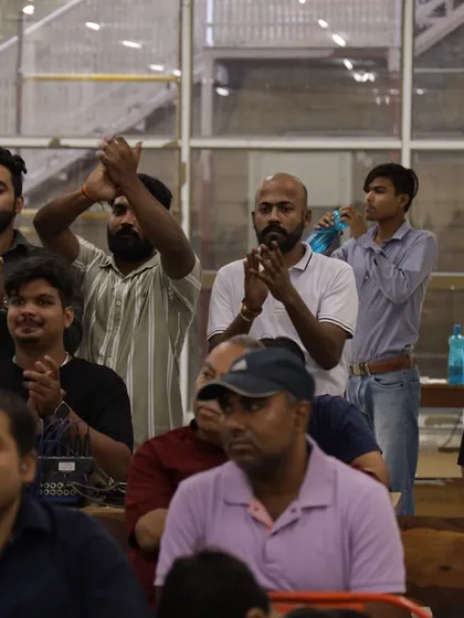 The audience is part of the performance. Here, you can see the crowd completely engaged, clapping along and sharing in the joy of the performers on stage.