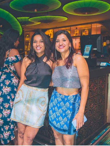 Guests enjoying the vibe at the bar. The music sets the perfect backdrop for a great Saturday night.