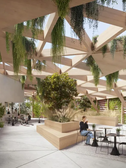 The rooftop garden provides a peaceful retreat with views over the city, combining nature and architecture in a dense urban setting.