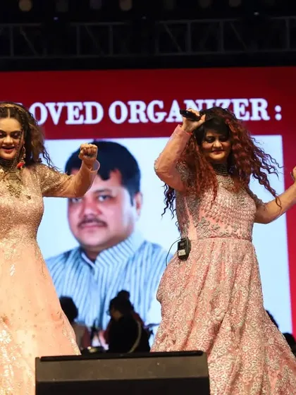 Dancing on stage in beautiful pink gowns. Our performances are a celebration of music, dance, and festive fashion.