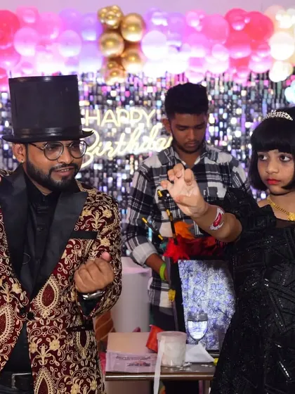 Teaching the birthday girl a magic pose. It's the small, personal interactions that make a party magic show truly special.