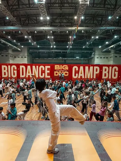A sea of dancers, all moving as one. This is the view from the stage at Camp Big Dance, where you get to learn from your idols in a massive, stadium-sized classroom.