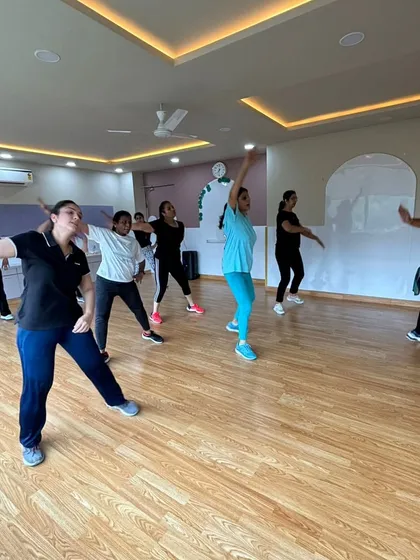 The joy of movement during our weekend Zumba workshop. We cater to all fitness levels, ensuring everyone has a great time.