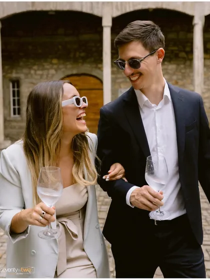 Pure, unadulterated laughter. Arm in arm, with wine glasses in hand, they share a joke. This is the kind of authentic, happy moment I strive to capture.