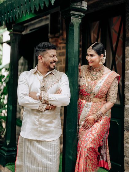 A candid shot of a couple sharing a laugh. Their matching outfits highlight our ability to create clothing that is not only beautiful but also comfortable and easy to wear.
