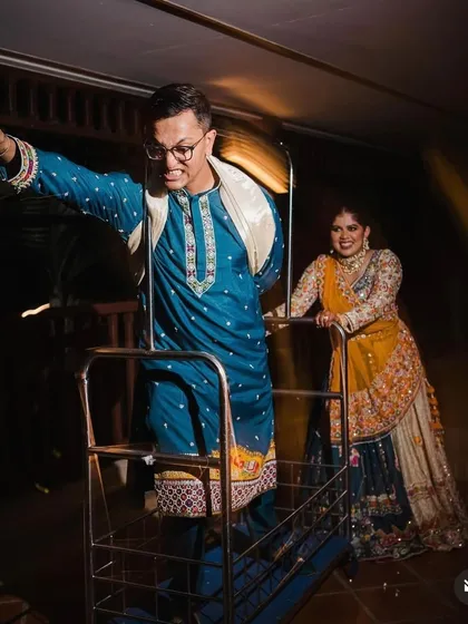 Celebrating their playful personalities and unmatched energy. This fun entry on a luggage cart was a perfect reflection of the couple's quirky and fun-loving vibe.