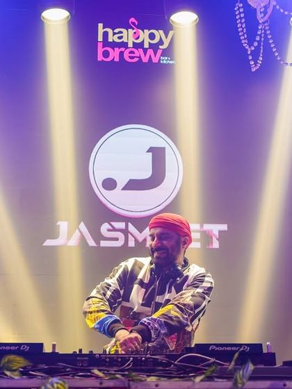 At the console at Happy Brew, with my logo displayed on the big screen.