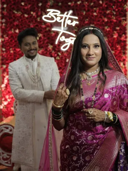 A royal reception look for a stunning bride. Here, I focused on creating a luminous, long-lasting base with soft, elegant eye makeup and a flattering lip color that perfectly complements her regal magenta saree and the celebratory atmosphere.