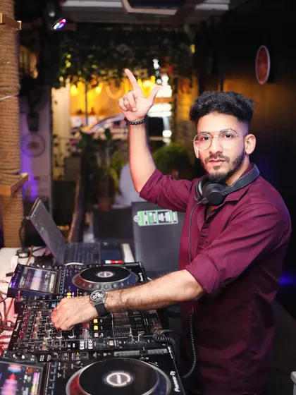 Another look back at an earlier gig at Tito's, with my hand up, signaling the beat drop to the crowd.