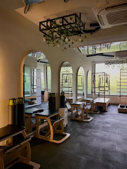 A look into our second studio space, featuring arched mirrors and modern decor. It’s all designed to inspire confidence and improve your posture.