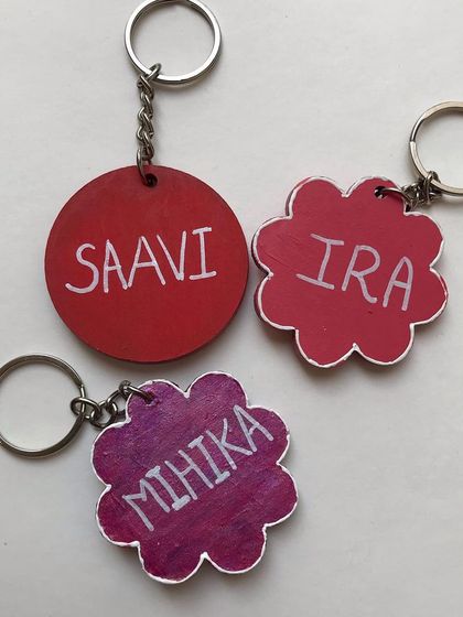 A set of handcrafted keychains and bag tags, showing both the decorated front and the personalised back. These are great for kids' school bags or as unique party return gifts.