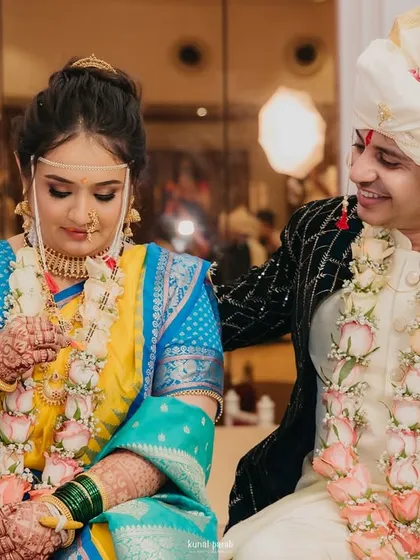 A beautiful moment from a real Maharashtrian wedding. I ensure my bride's makeup is perfect from every angle and stays fresh through all the rituals.