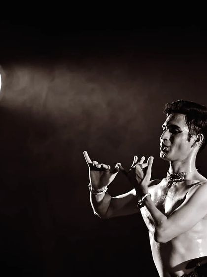 A black and white shot capturing the intensity of a performance, with the stage light creating a dramatic effect. I often use lighting to enhance the mood and focus of my storytelling.