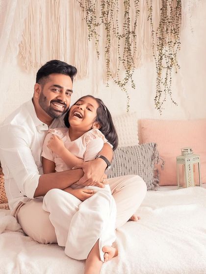 Another beautiful moment of laughter and love between this father and daughter. These unposed, natural interactions create the most authentic and heartwarming family portraits.