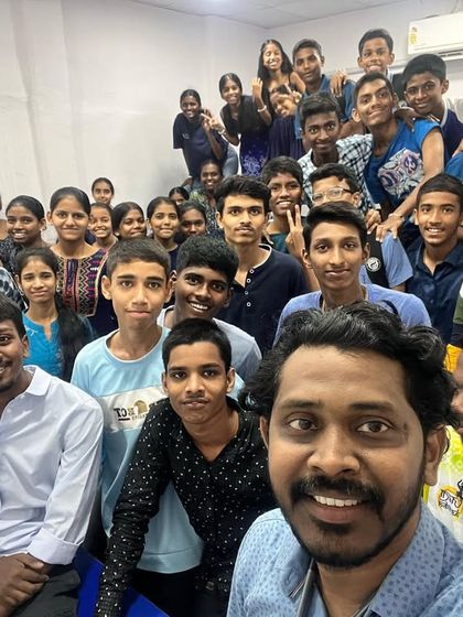 A full classroom selfie showing the widespread participation for the royal blue theme of Navratri 2023.