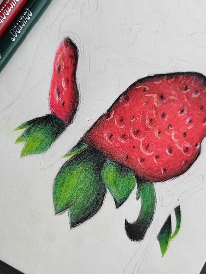 Another angle of the strawberry in its early stages.