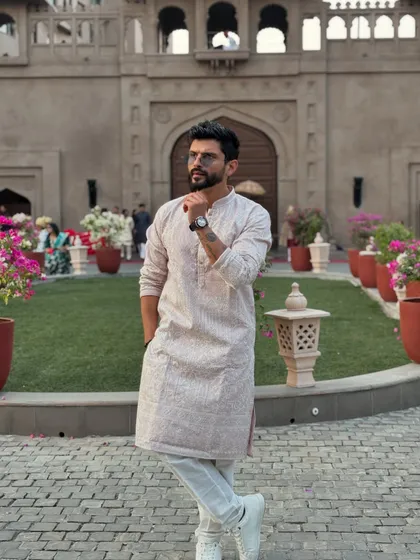 Wrapped in tradition for the wedding season. A simple yet elegant kurta look for a classic wedding event.