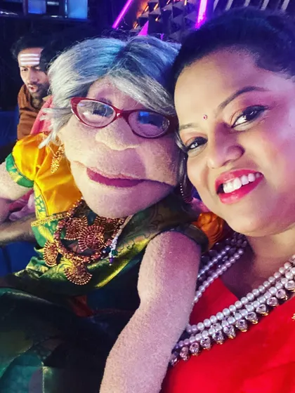 Capturing a fun moment with Ajji before going on stage. The bright lights and our smiles say it all.
