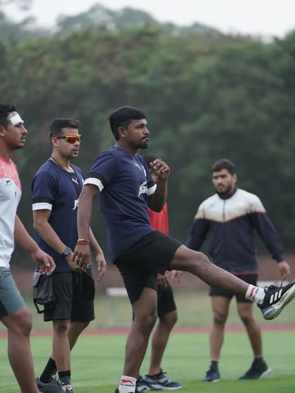 All eyes ahead. Leading the team through a warm-up on the field, setting the focus for the session.
