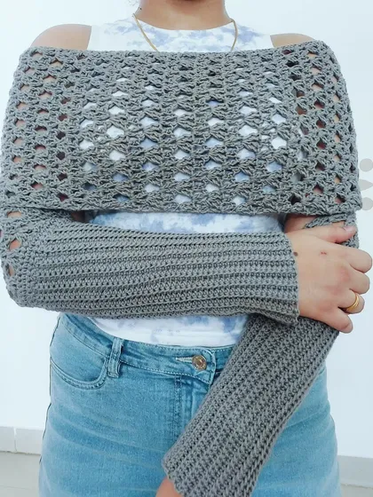 This is my Sweater Scarf, a versatile piece that can be worn as an off-the-shoulder shrug. The ribbed sleeves provide a snug fit while the body drapes elegantly.