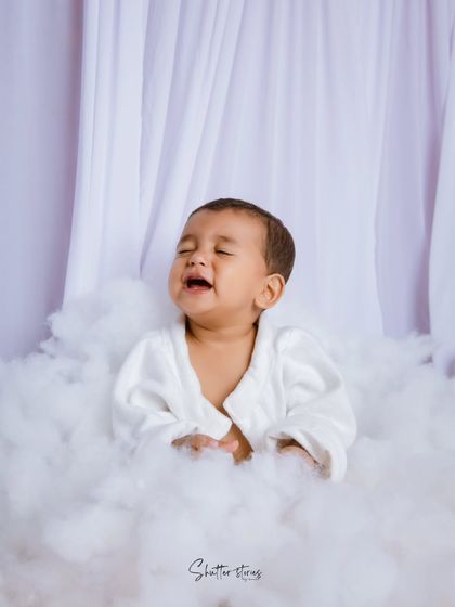 Even a sleepy, grumpy face is an adorable memory to capture during a milestone session. It's all part of their little personality!