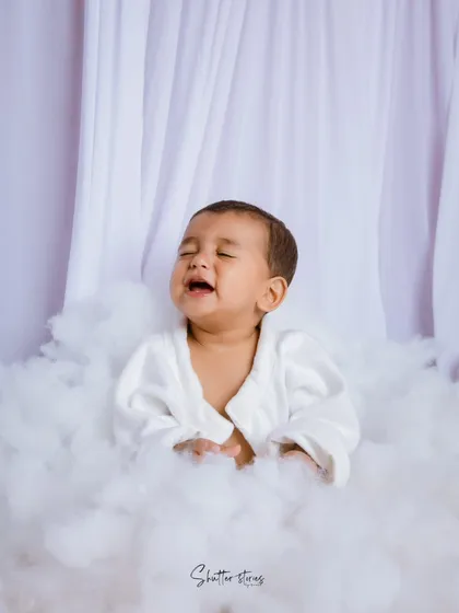Even a sleepy, grumpy face is an adorable memory to capture during a milestone session. It's all part of their little personality!