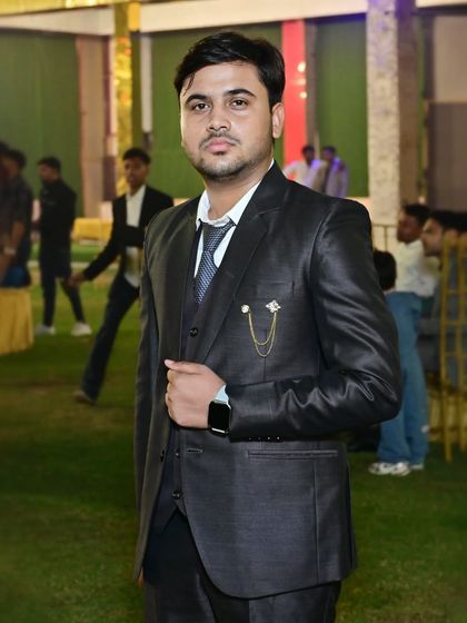 A guest looking sharp in a three-piece suit at an evening function. I take individual portraits of guests in their party attire.