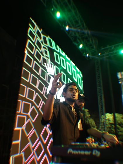 A dynamic shot from my performance at Chandigarh University, with the stage visuals creating a high energy backdrop. I blend my music with engaging visuals for a full sensory experience.
