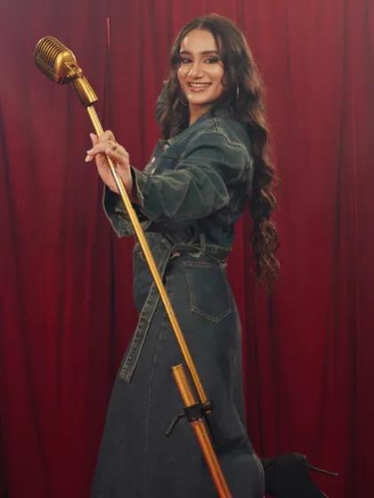 A full-length shot from the Freakins campaign. The soft, wavy hair and natural makeup create a relatable and aspirational look for the brand's target audience.
