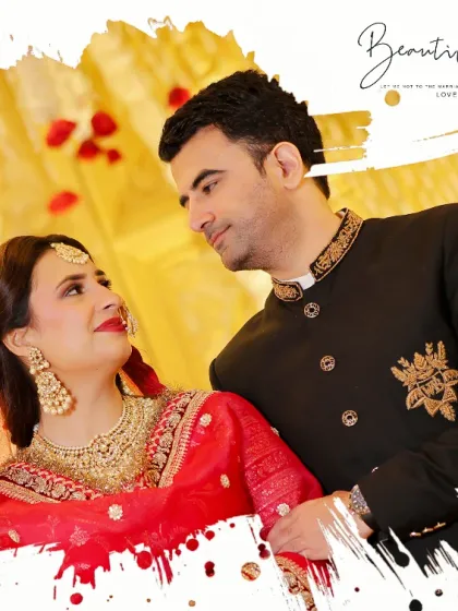 A romantic portrait of a couple on their wedding day, with an artistic brushstroke effect. The bride in her red lehenga and the groom in his black sherwani look at each other with pure love.
