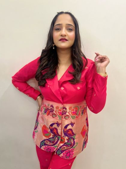 A confident and stylish pose from Aditi. Her modern hairstyle with front braids adds a trendy touch to her overall look.