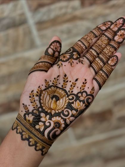 The other hand, featuring a lovely lotus and floral pattern.