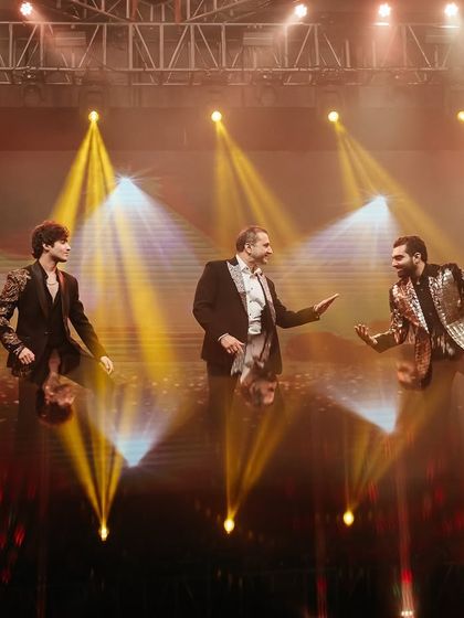 The three musketeers: the groom with his father and brother. This trio's performance was full of energy and fun, showcasing their amazing family bond.